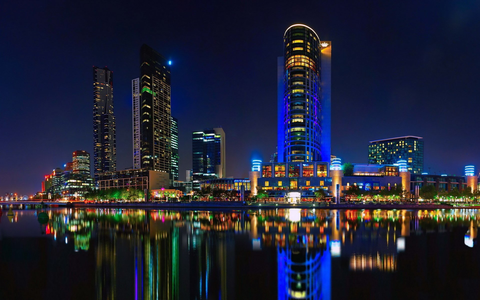 colored lights big city lights over water water river skyscrapers light reflection the sky night city the lights of the city