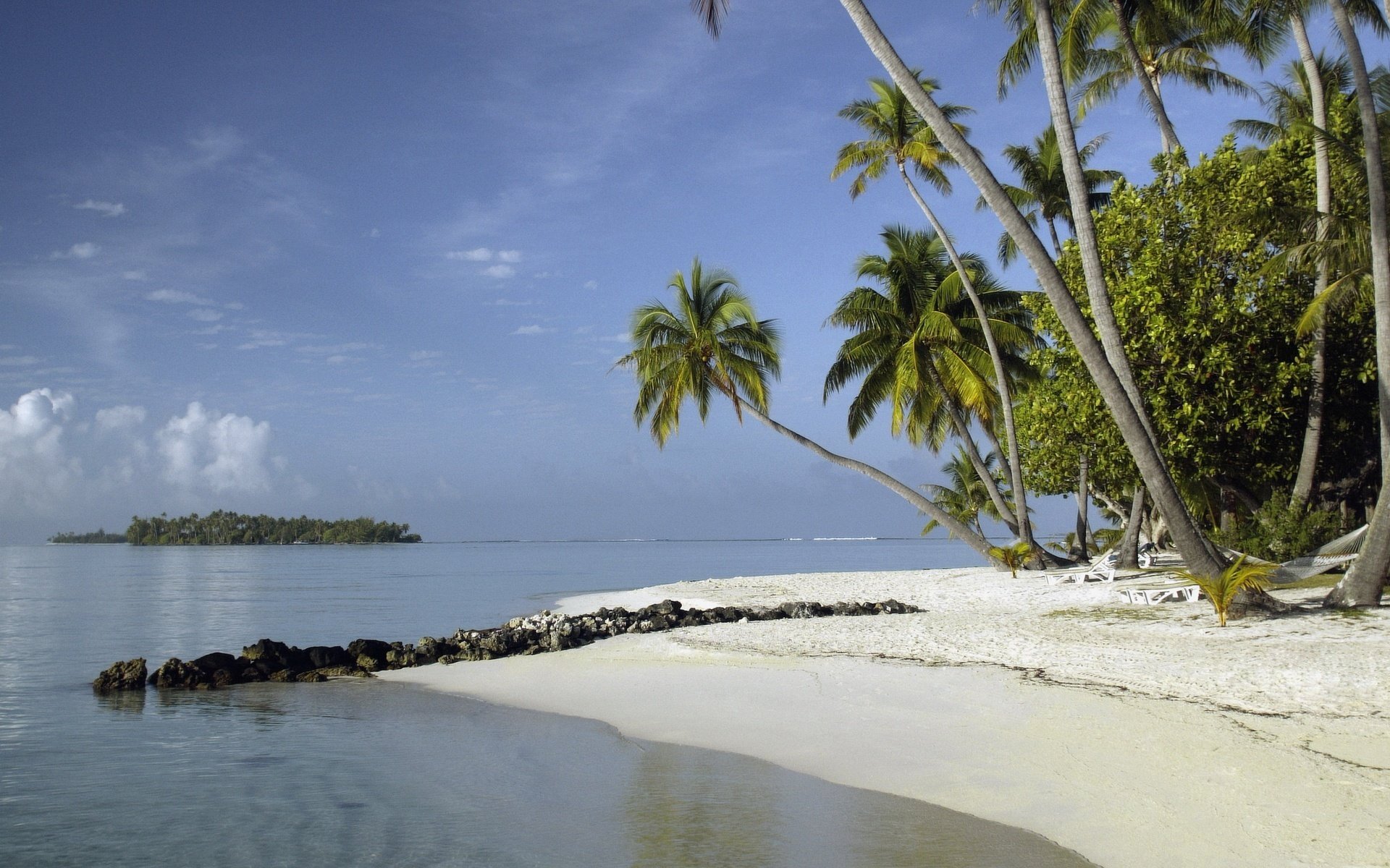 jamba de tierra piedras costa de arena playa agua cielo palmeras verano calor calor costa arena resort islas océano paisaje naturaleza