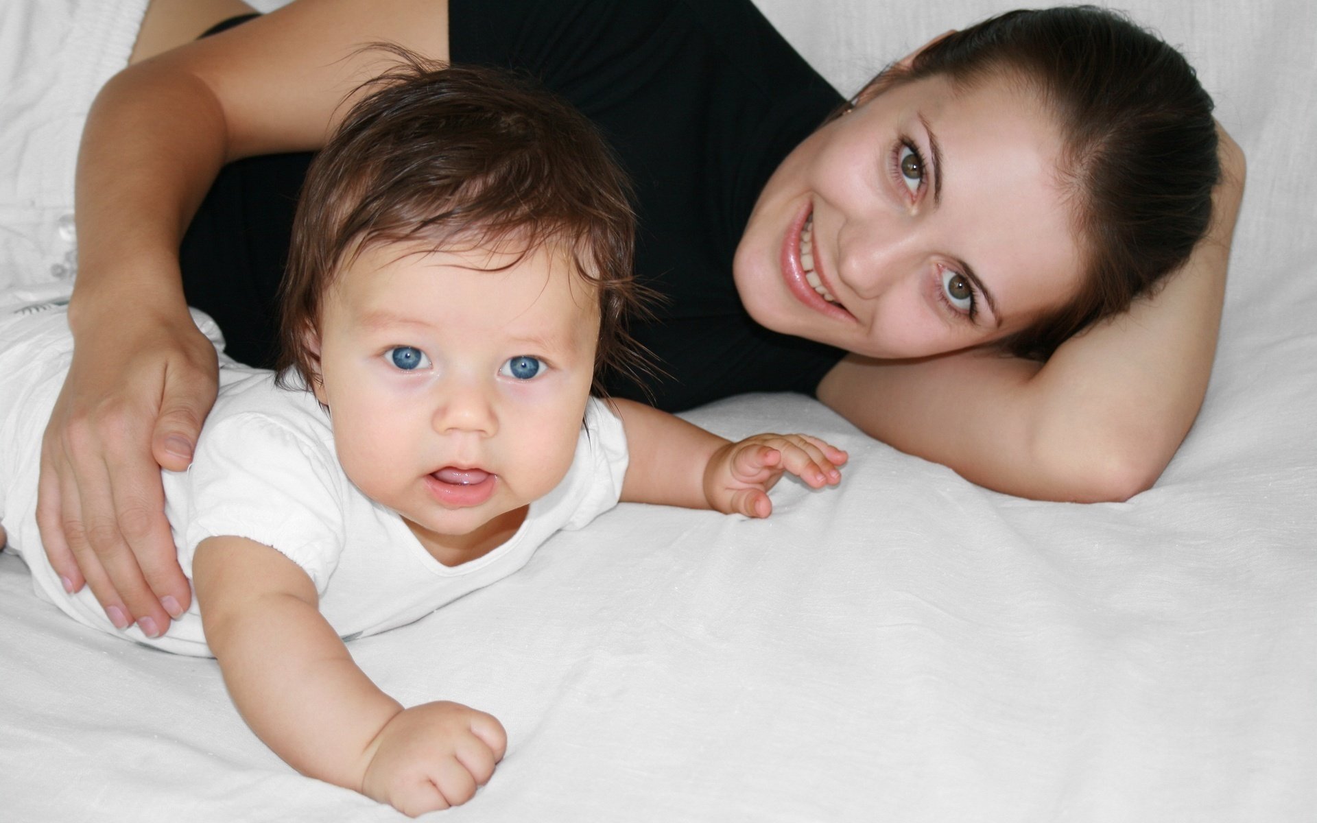 mother and child blue-eyed creation together look smile eyes face joy
