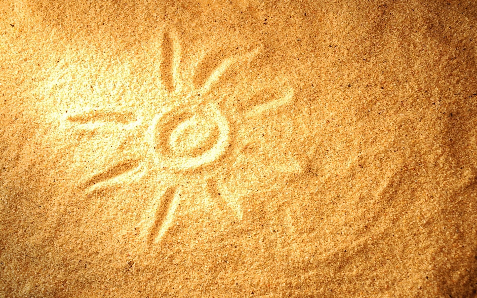 dessin sur le sable soleil chaleur sable