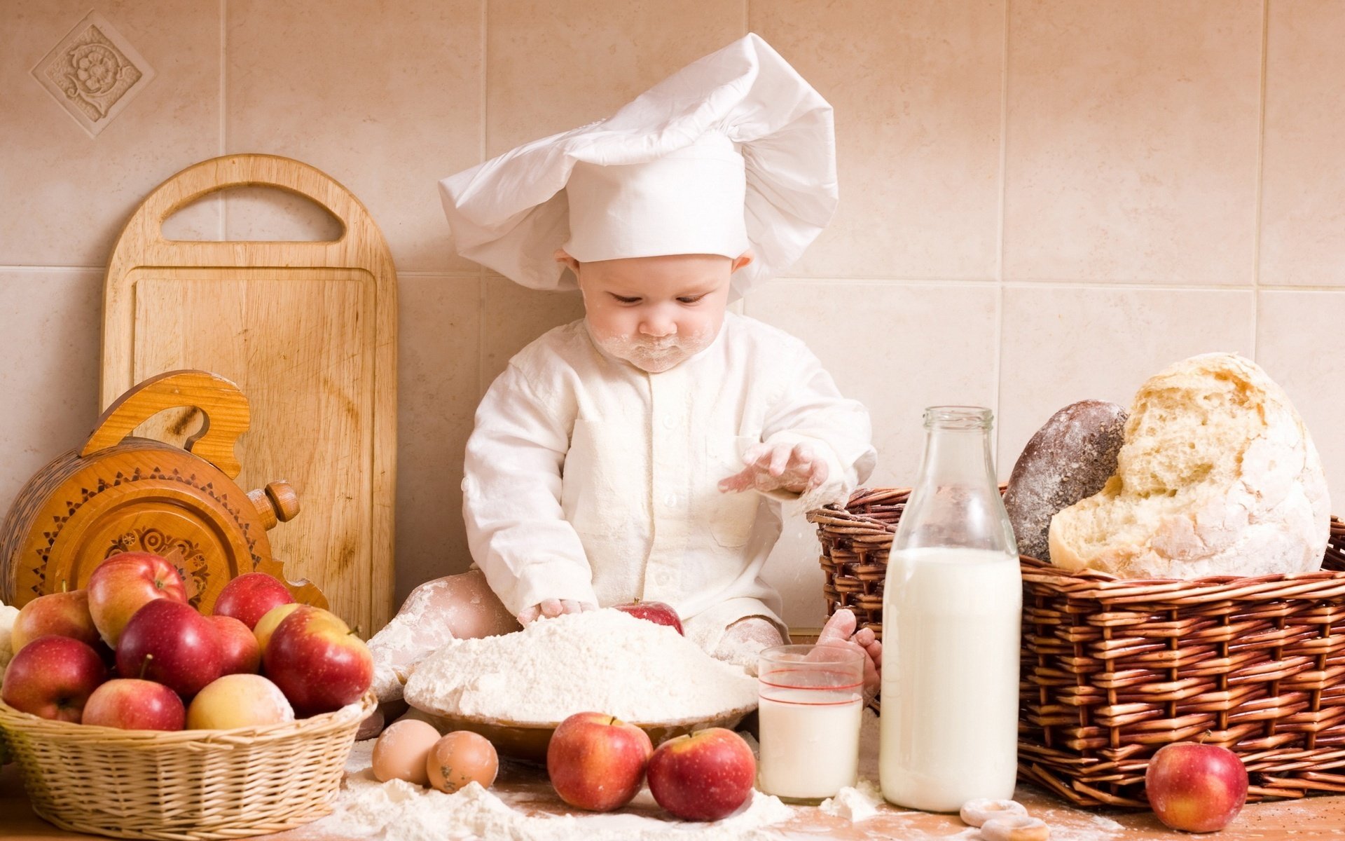 kitchen boy covered in flour smudge in the kitchen cooks baby baby baby fun game pranks flour milk bottle apples fruit bread glass board face
