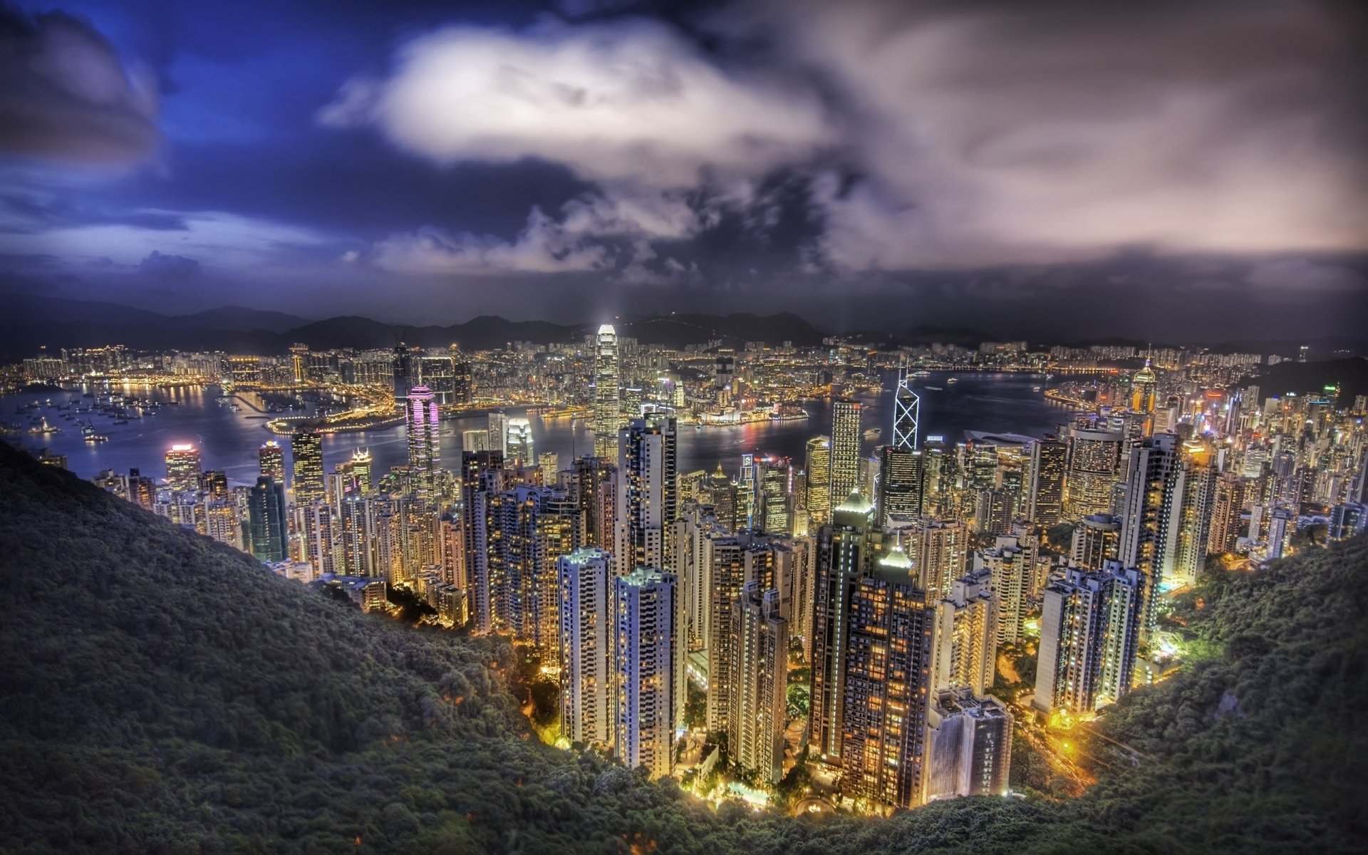 torm in the sky panorama high-rise buildings hundreds of floors the storm city skyscrapers the night sky the lights of the city. night view height clouds usa america