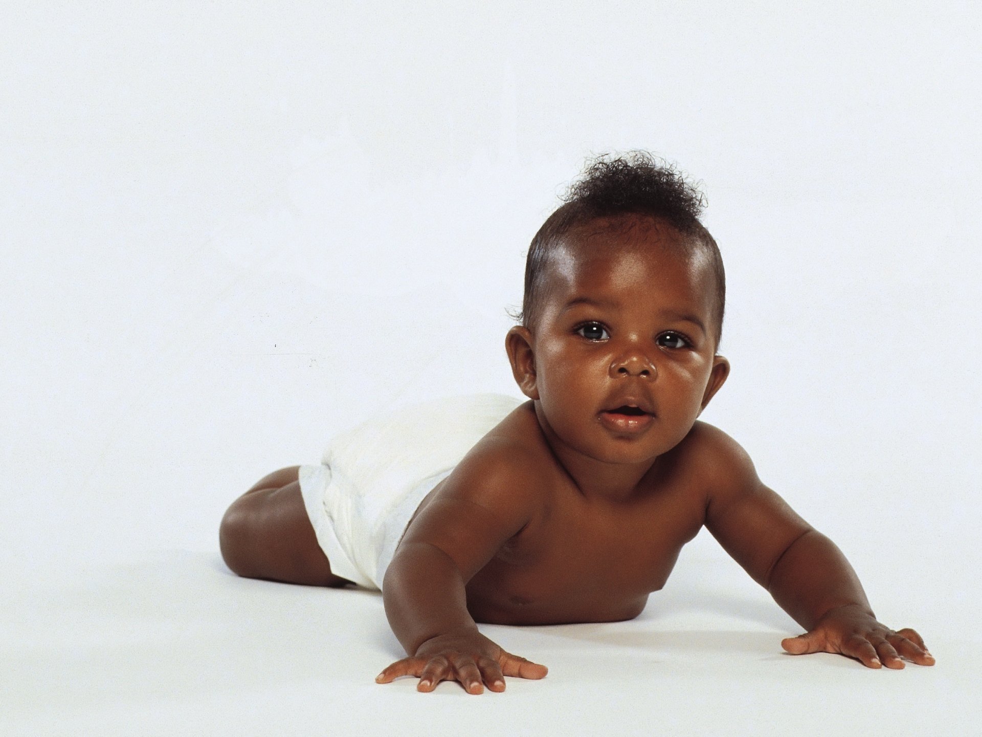 little black baby plump lips look boy dark-skinned child baby egoza fidget white background eyes face portrait