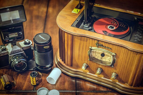 A picture of a camera and a player on a wooden floor