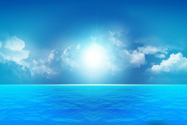 The sun shining through the clouds and the calm blue sea