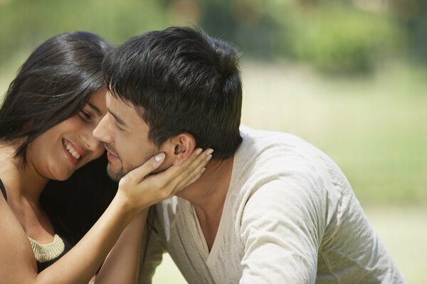 A couple in love in a sunny glade