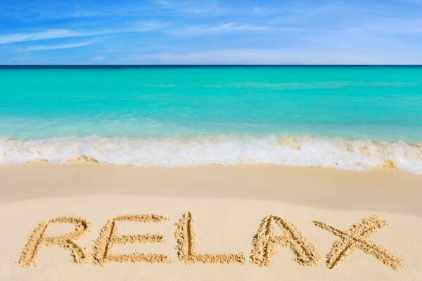 Summer beach with hot sun, sky with clouds, Relaxing beach by the sea with emerald water, clean sand, sky with clouds