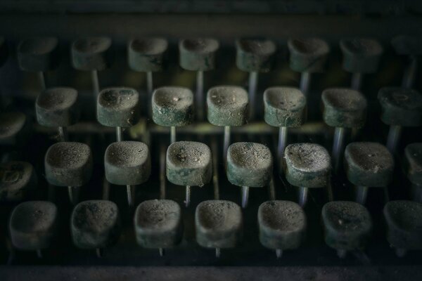 An old typewriter covered in dust