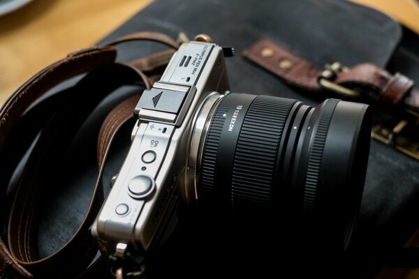 Beautiful Olympus epm2 camera on a briefcase