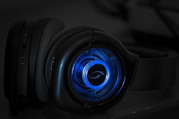 Stylish headphones with backlight on a dark background