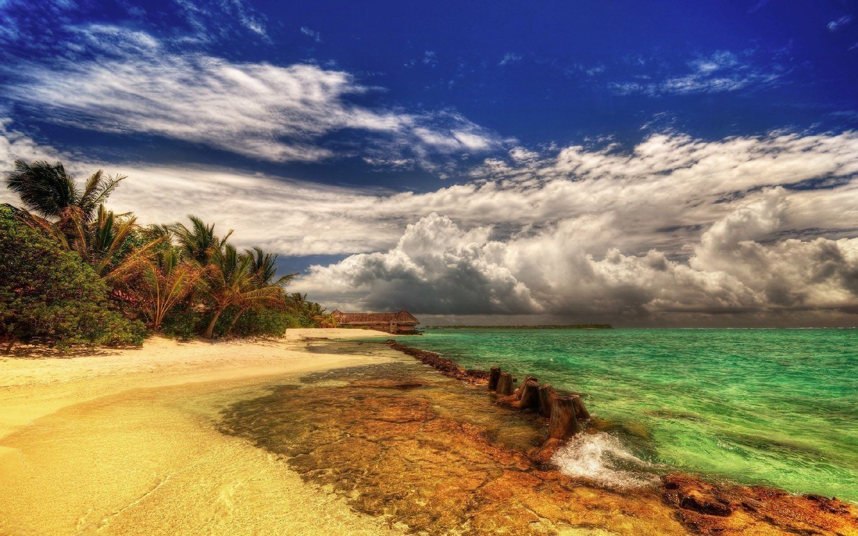 tropical beauty storm gray clouds beach water the sky shore sea island surf summer heat paradise resort vacation stay landscape nature palm trees trees vegetation sand