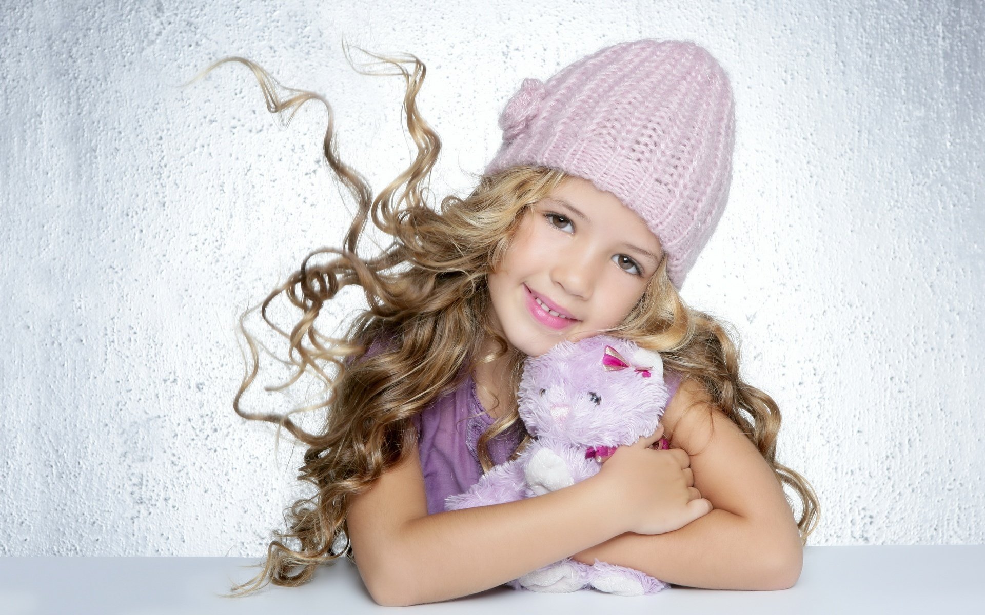 oft kitty little girl lovely creation portrait look smile face the wind hair curls toy hat baby girl wall