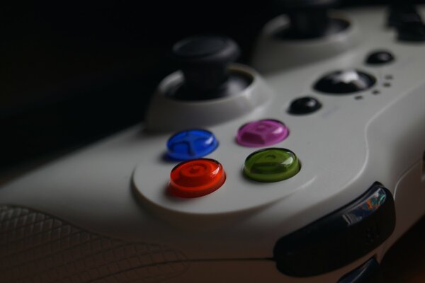 White gamepad close-up on a dark background