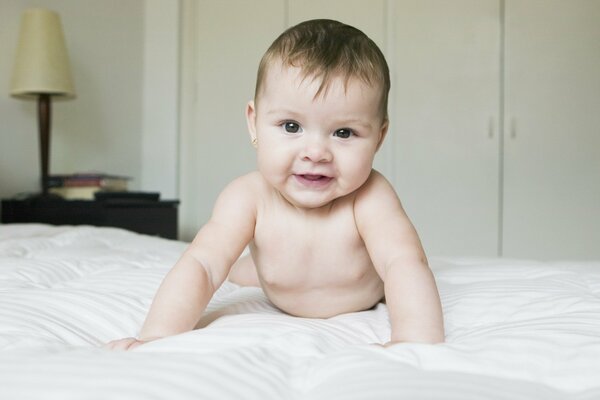 The baby makes the first attempts in the parents bed