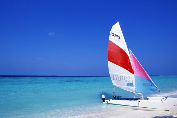 Sailboat by the water, beautiful nature around