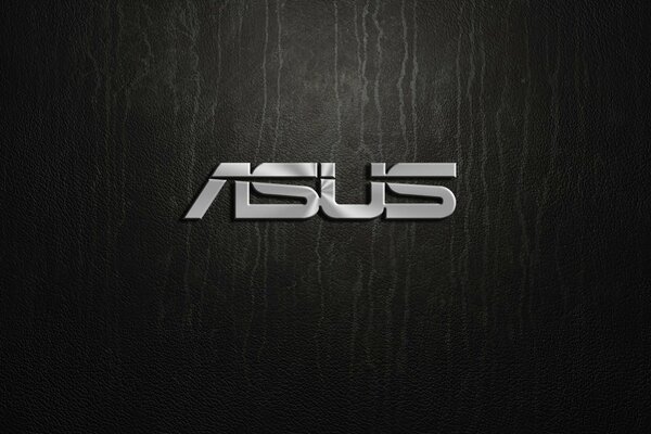 Silver Asus logo on a black background