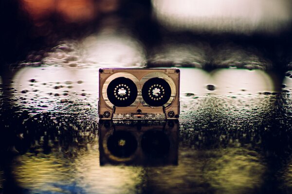 A cassette with an image of wet asphalt