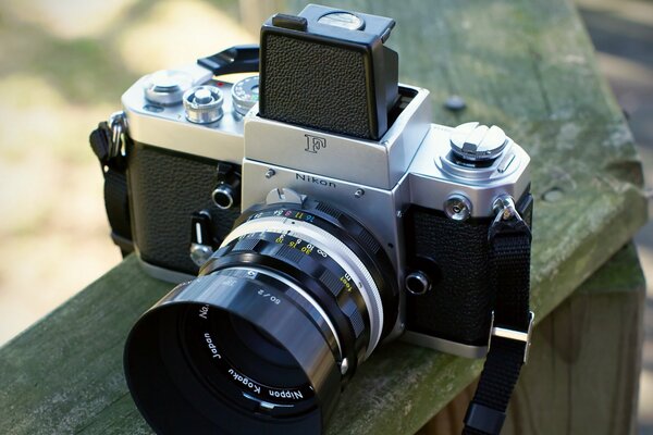 Vintage camera on a wooden bench