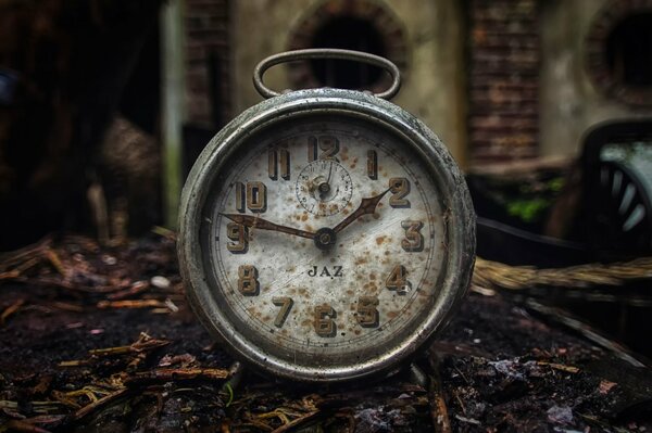 Old pocket watch with rust