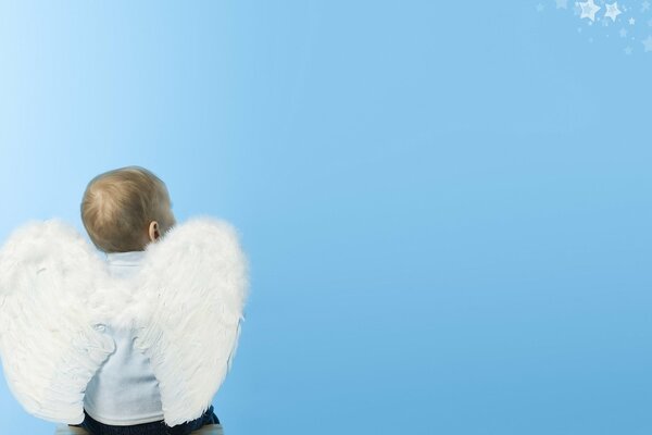 A child with angel wings on his back