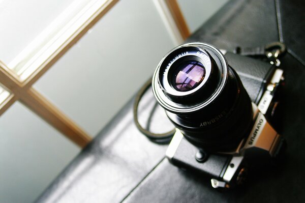 OLYMPUS film camera on the windowsill