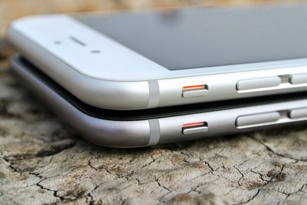 Two iPhones lying on top of each other