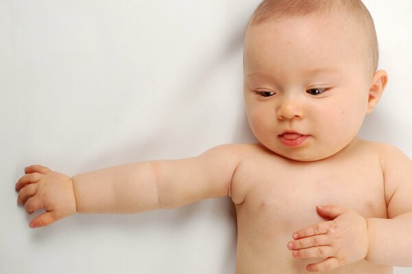 Cute baby on a white blanket