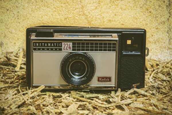 KODAK CAMERA ON PACKING SAWDUST