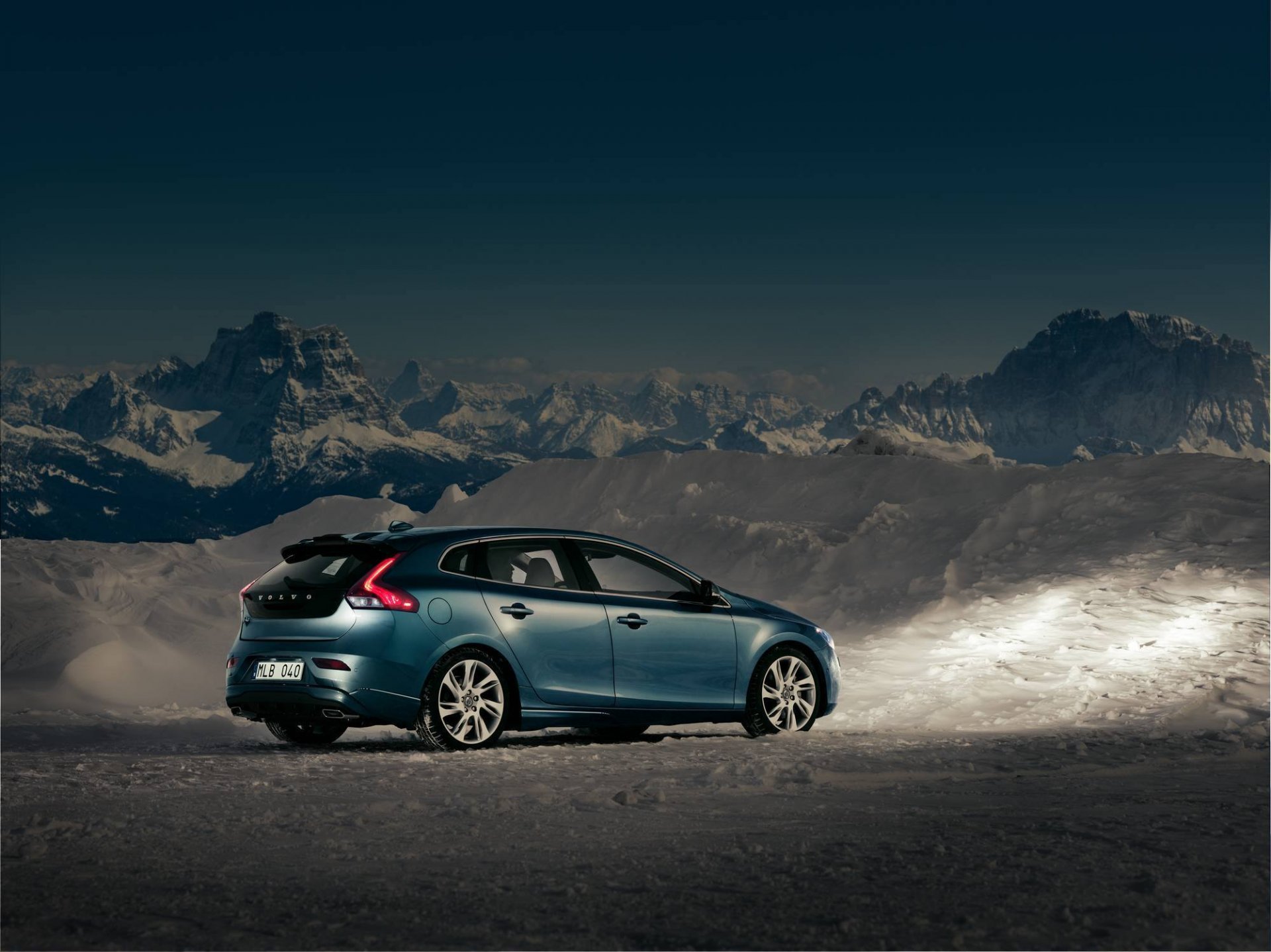 volvo v40 twilight snow mountain sky car