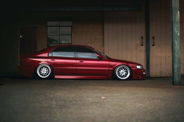 Red Honda on ice rinks near the garage