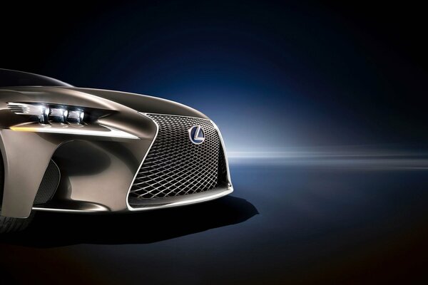 A beautiful image of the hood of a lexus car with a grille and headlights