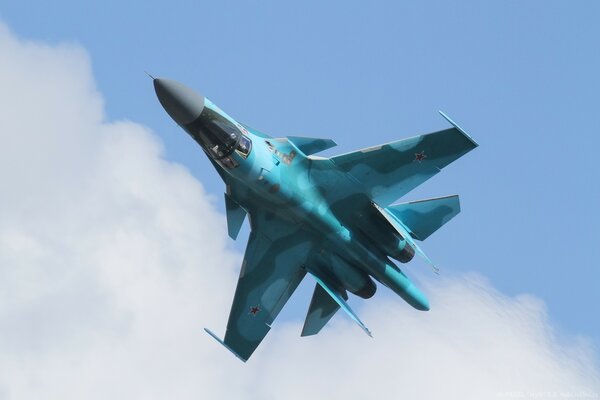 Su-34 fighter in the blue sky