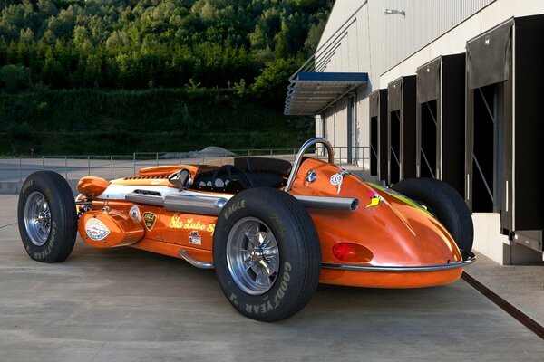 Powerful orange sports car - feel like a legend