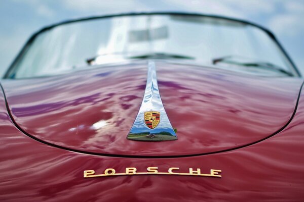 Large view of the hood of a red Porsche car