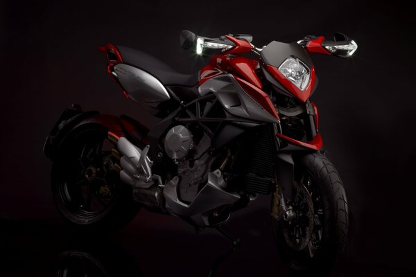 Red and black mv agusta rivale on a black background