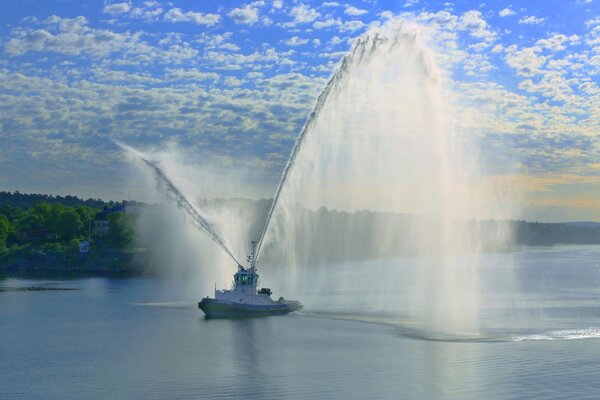 The water cannon ship arranged a fountain in the sea