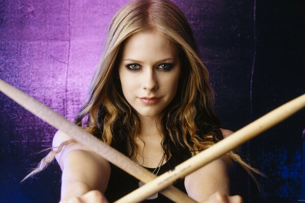 Beautiful long-haired girl with drumsticks