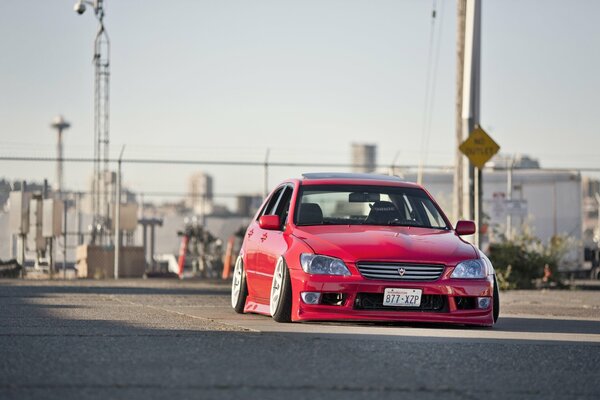 Red tuned Lexus with air suspension
