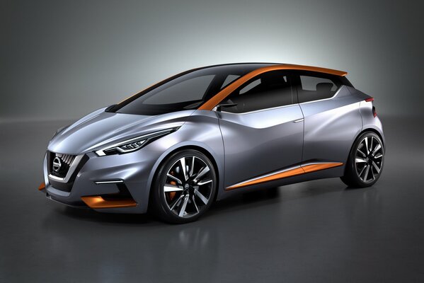 Grey Nissan hatchback with orange inserts