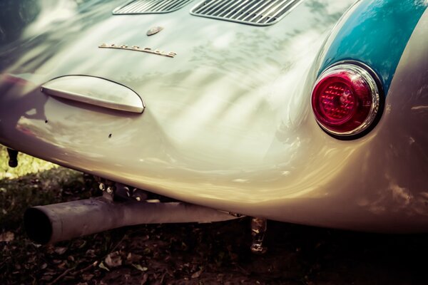 The hood of an old Porsche 550 in the sun