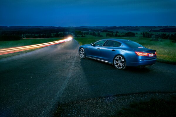 Aged maserati on the night road