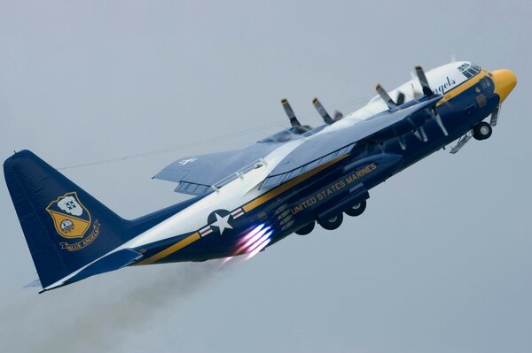 Lockheed C 130 takes off into the sky