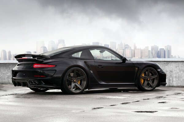 Porsche in black on a gray background