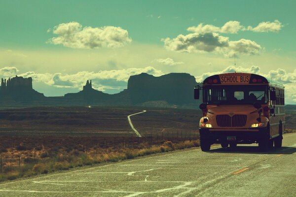 School bus rides on the road