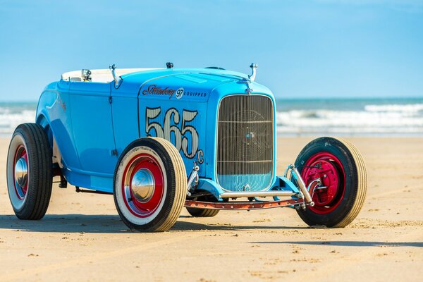 Classic blue retro car. hot rod. on the beach