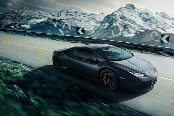 Lamborghini at speed among the winter mountains