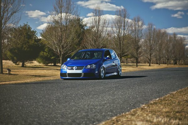 Volkswagen golf in autumn on the road