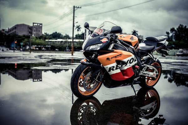 Standing motorcycle bike in rainy weather