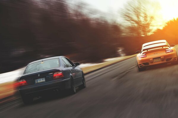 Race of two cars BMW and Porsche