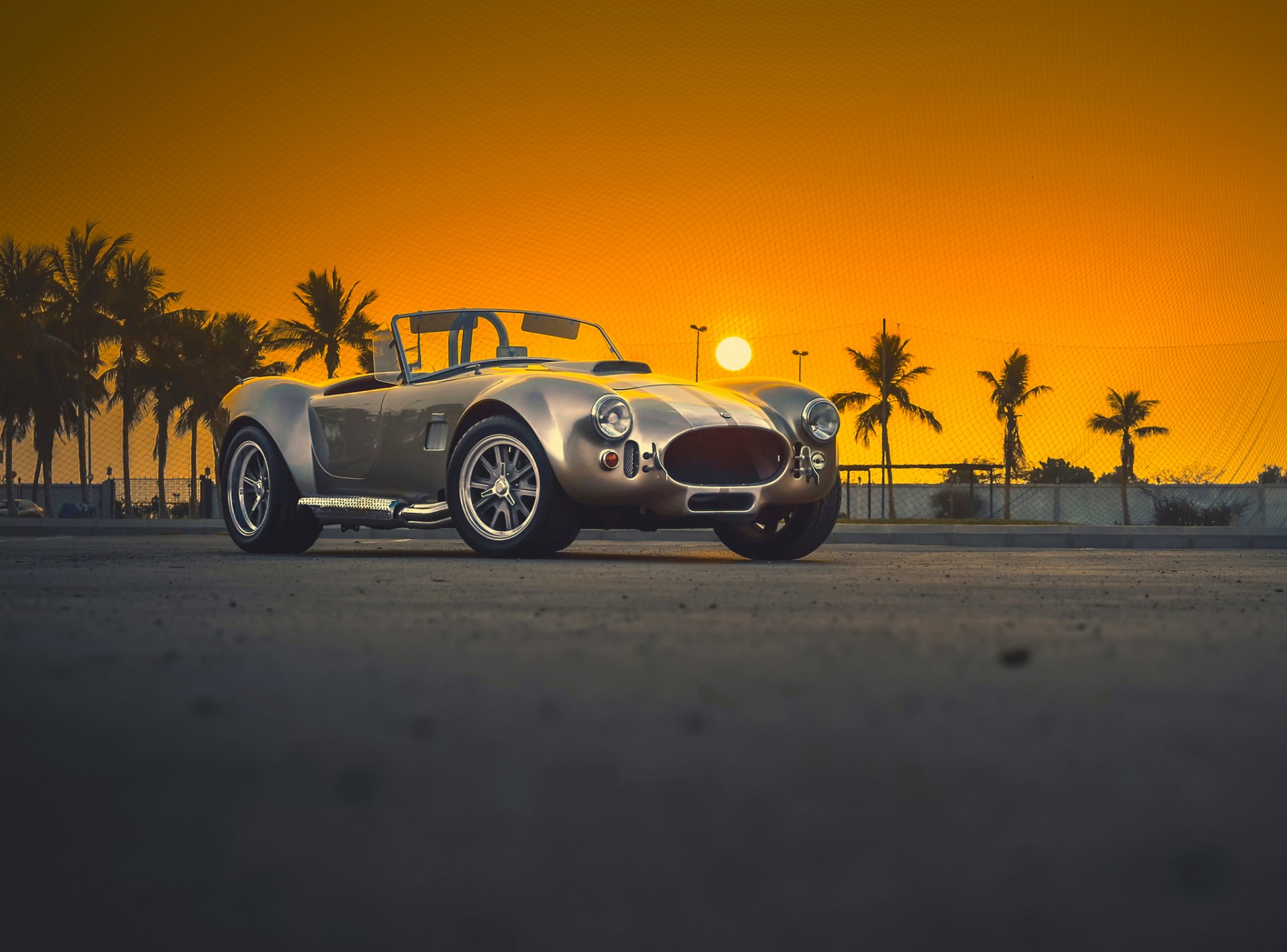 shelby ac cobra increíble clásico coche viejo puesta de sol frente